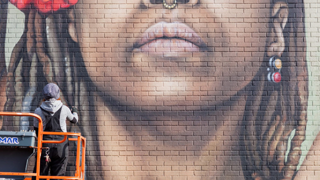 Mural artist Sarah Rutherford creates large-scale street art portraits of women in Rochester, New York.